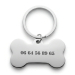 Gravierte Hundemarke in Knochenform Gravierte Hundemarke in Knochenform